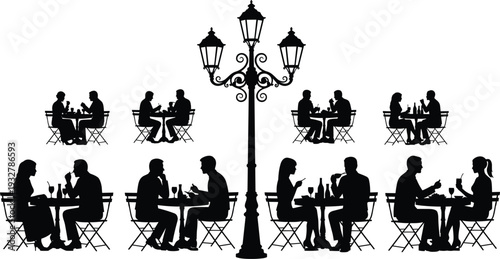 Two women silhouettes sitting at cafe table under umbrella, friends talking and drinking coffee at outdoor restaurant terrace