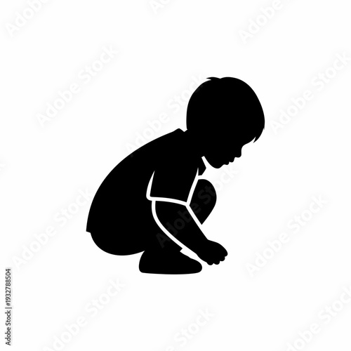 Silhouette of a baby kneeling down.