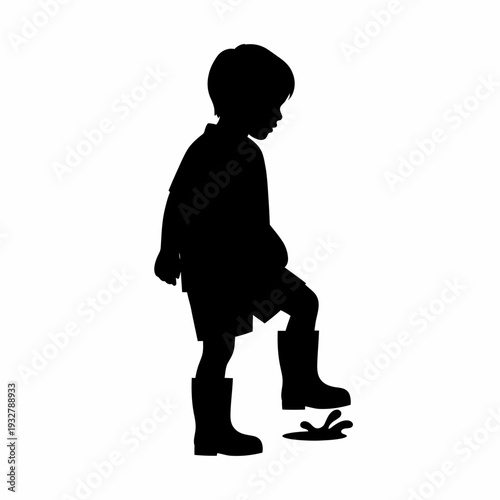 Silhouette of a Young Boy Standing.