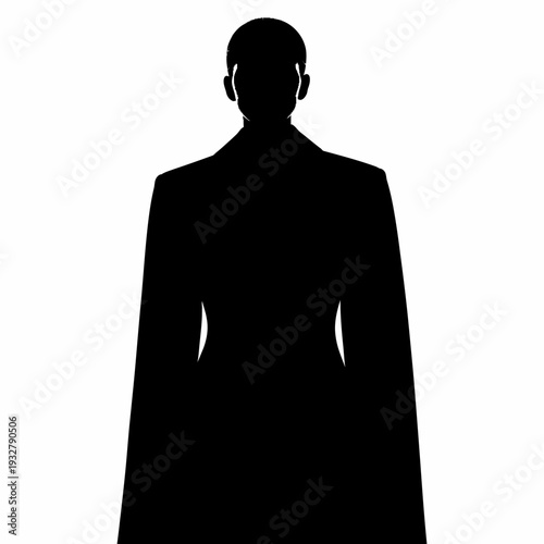 Silhouette of a man in coat standing.