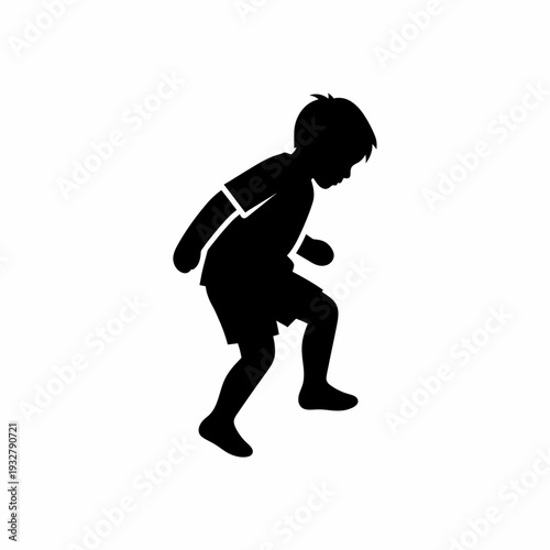 Silhouette of a Running Young Boy.