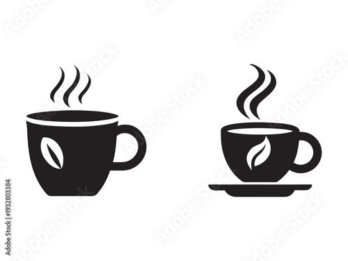 Two black coffee cups with steam rising and coffee leaves on the sides one on a saucer