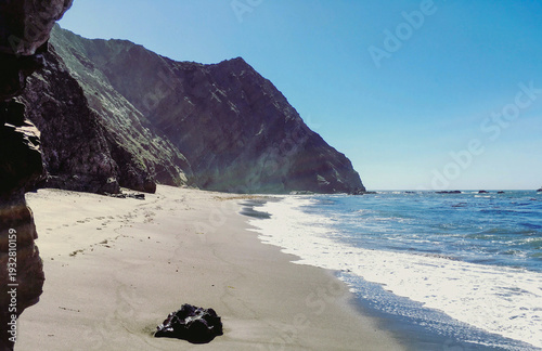 Breathtaking scenic and landscape view of coastline of Californian OC landscape scenery with vegetation and cliffs and beautiful bays overlooking ocean and coast in California on sunny day blue sky