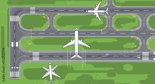 Top down aerial perspective of a busy airport runway system with multiple commercial airplanes taxiing on the ground and parked on the green grass.