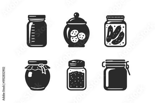 Collection of six different glass jars and containers with lids and contents