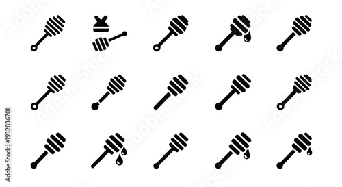 Collection of black honey dippers with varying orientations on a plain background viewed from directly above