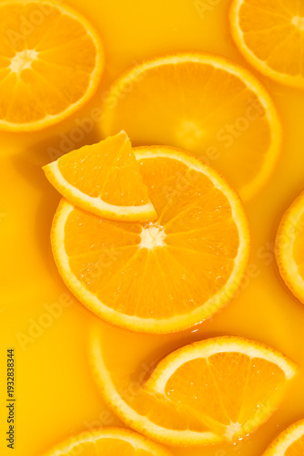 Wallpaper Mural Vertical macro of orange slices in fresh juice, mobile wallpaper. Torontodigital.ca