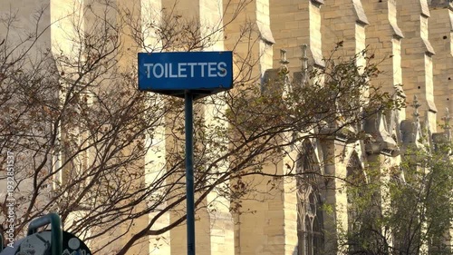 Public restroom French signage in the square area surrounding Notre-Dame de Paris Cathedral