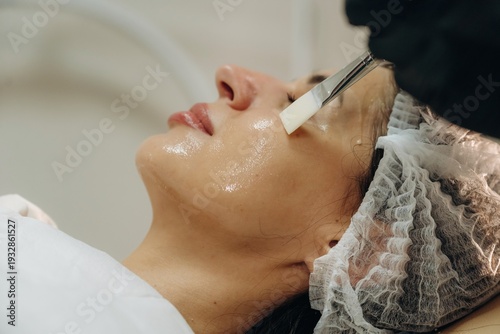 Wallpaper Mural Rejuvenation process. Facial skincare treatment with a cosmetic device in a beauty clinic Torontodigital.ca