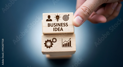 Business idea concept with wooden blocks and hand arranging marketing strategy elements effectively together