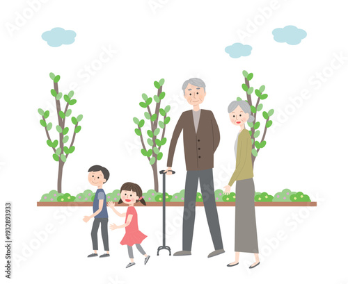 散歩するシニア夫婦と孫