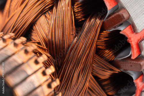 Foto Electric DC motor rotors with copper commutator and coil wire winding texture background