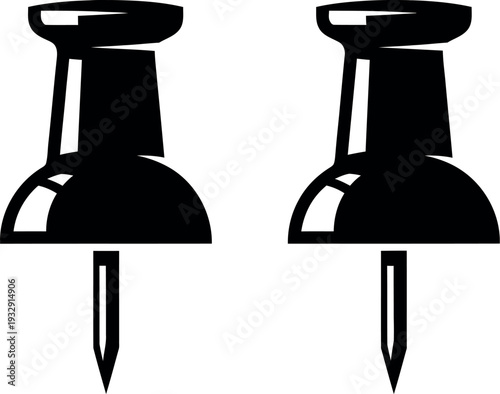 Two black push pins standing upright on a plain background