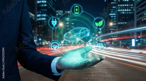 Businessman holding holographic interface displaying electric vehicle concept and green energy icons
