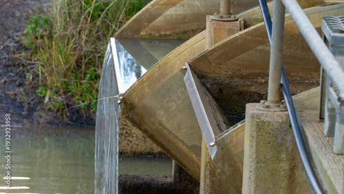 FlumeGate Irrigation water flow regulator and control gates that are remotely controlled and solar powered on a man made channel.	