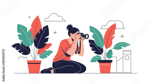 Young woman photographer kneeling and taking photos with a professional camera surrounded by large potted plants.