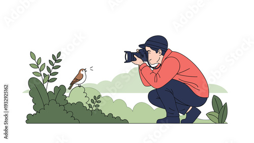 Nature photographer kneeling in the grass to capture a close-up picture of a small brown singing bird perched on a bush.