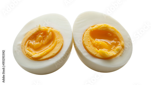 Two halves of boiled eggs yellow yolk isolated on a transparent background