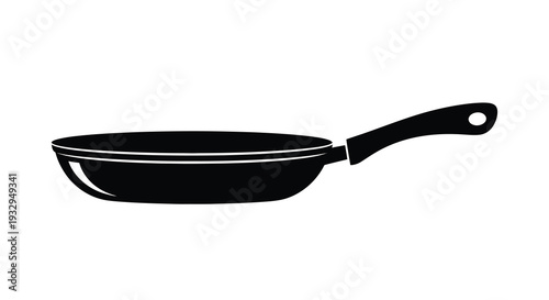 A stark black silhouette of a frying pan rests on a white background conveying simplicity and kitchen utility silhouette
