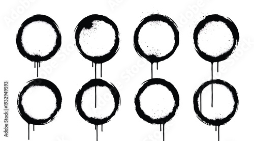 A group of eight black circles with drips on a white background, isolated on white background