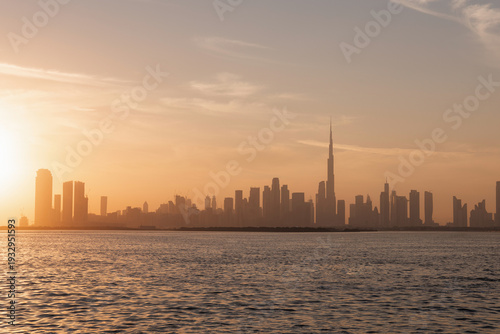 Canvastavla Sunset city skyline view from Dubai Creek Harbor, futuristic skyscrapers and vibrant desert sunset sky