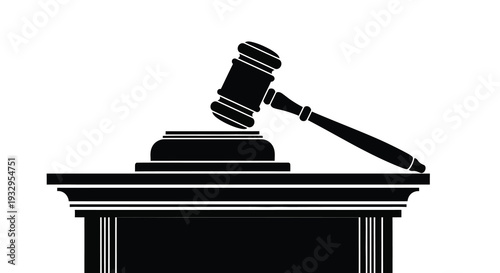 A stark black silhouette of a gavel resting upon a sound block and judicial base a symbol of justice silhouette