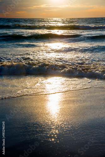 Canvastavla The shimmering reflection of the sun on the Andaman Sea during the golden hour in Thailand