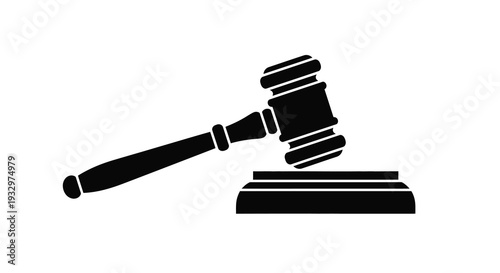 A striking black silhouette of a gavel resting on a soundblock representing law order and judicial proceedings silhouette
