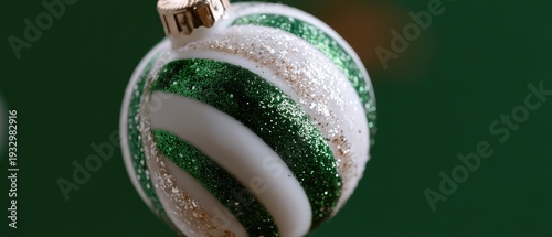 A green background features a candy cane and a green ornament on the side, suitable for holiday themes and decorations.