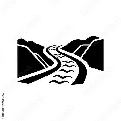 A winding river path cuts through mountainous terrain captured in a striking silhouette