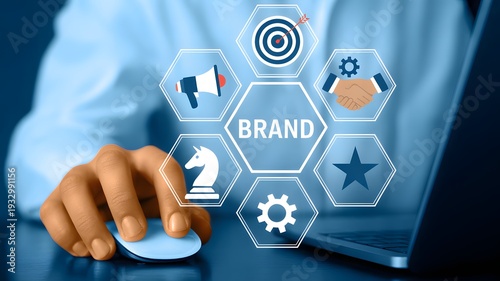 Businessman interacting with digital brand strategy interface on computer screen with icons and symbols