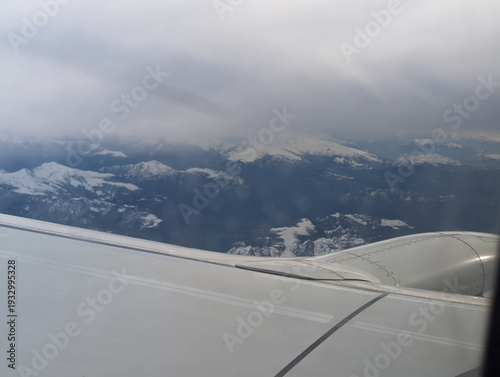 view out of the window of a Ryanair flight over the alps in europe