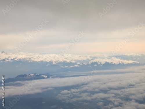 view out of the window of a Ryanair flight over the alps in europe