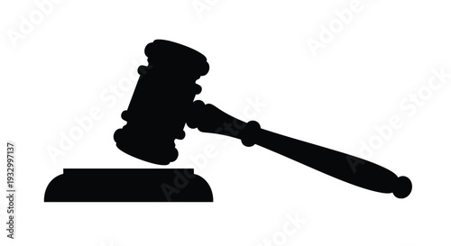 A stark black silhouette of a traditional gavel resting on a sound block symbolizing law and order silhouette