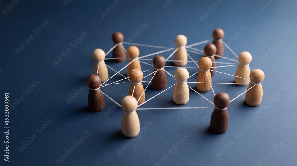 Obraz premium A group of connected wooden figures representing teamwork and collaboration