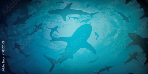 A school of sharks swimming in the deep blue ocean water.