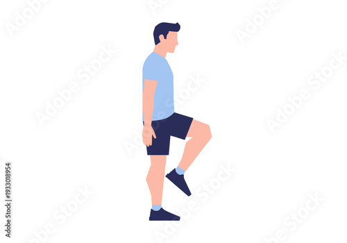Man performing a single leg balance exercise in a blue t-shirt and black shorts.