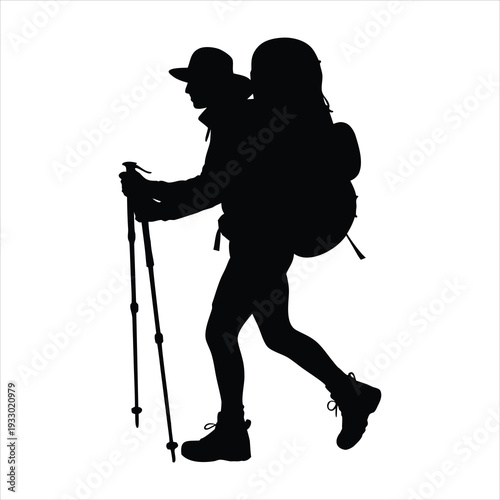 Hiker with backpack walking on trail with trekking poles