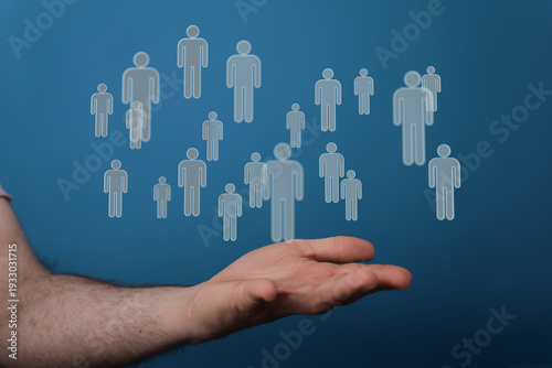 Digital human figures hover...