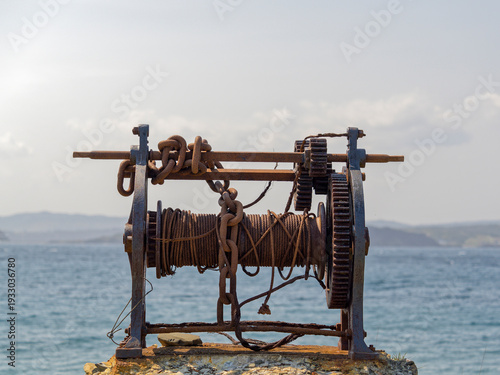 An old marine winch rusted over time.