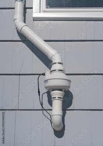 radon mitigation installed system outside the house
