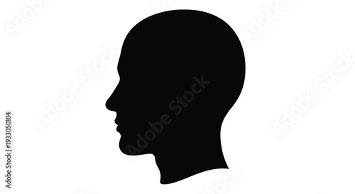 A stark black profile of a human head against a white background emphasizing form and shadow a striking silhouette