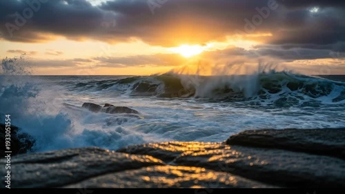 Dramatic Ocean Waves Crashing Against Rocks at Sunset with Golden Light.