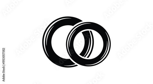 Two black tires interlocked in a circular abstract design against a white background
