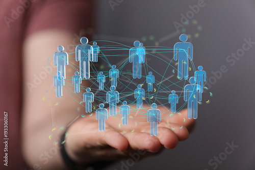 Hand holding digital people...