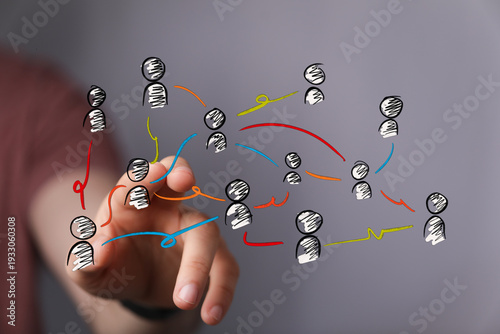 Hand touching a network of ...