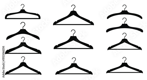 An arrangement of black coat hangers displayed in a simple silhouette