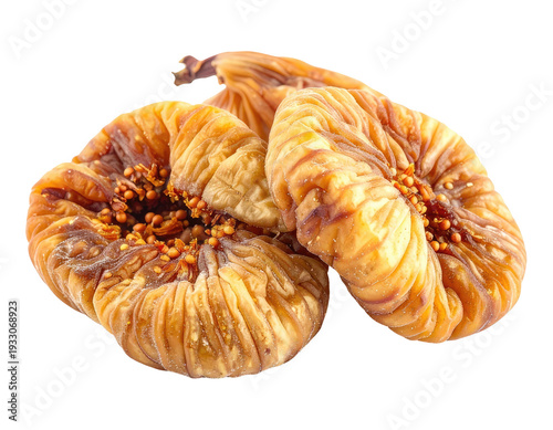 Two golden dried figs with visible seeds, on black background
