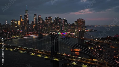 Breathtaking view of New York City, Evening. View of the Manhattan skyline, East river and Brooklyn bridge. The lights of the skyscrapers are turns on. Global Business, Urban Nightlife