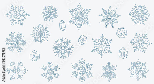Collection of intricate blue snowflakes in various shapes and sizes on a clean white background symbolizing winter and the holiday season